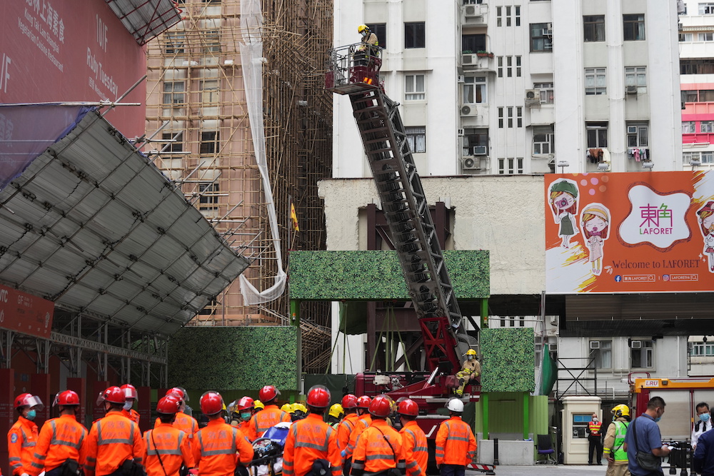 Firefighters operate an extendable ladder to rescue people trapped in a fire that broke out at the World Trade Centre in Hong Kong, China December 15, 2021. u00e2u20acu201d Reuters pic