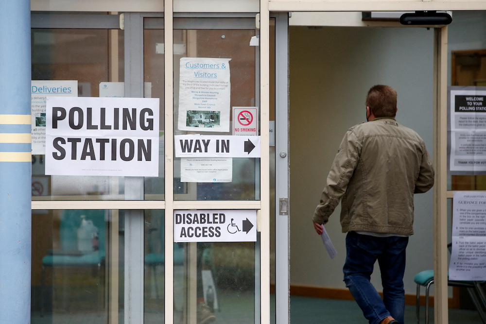A voter enters a polling station during the North Shropshire by-election, in Wem, Britain December 16, 2021. u00e2u20acu201d Reuters/Ed Sykes pic