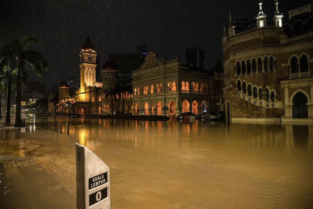 The area around Dataran Merdeka in Kuala Lumpur is submerged by floodwaters amid incessant rain, December 19, 2021. u00e2u20acu201d Picture by Firdaus Latif