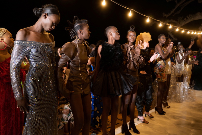 Models presenting creations by different designers stand on the stage at the end of the show during the 19th annual Dakar Fashion Week at the Baobad forest, Mbour, Senegal. u00e2u20acu201d Reuters pic