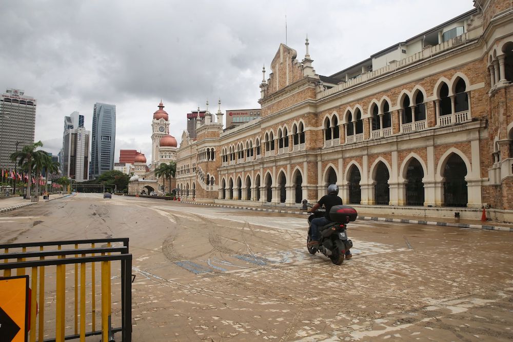 Dataran Merdeka is seen covered in mud after the floods, December 19, 2021. u00e2u20acu201d Picture by Choo Choy May