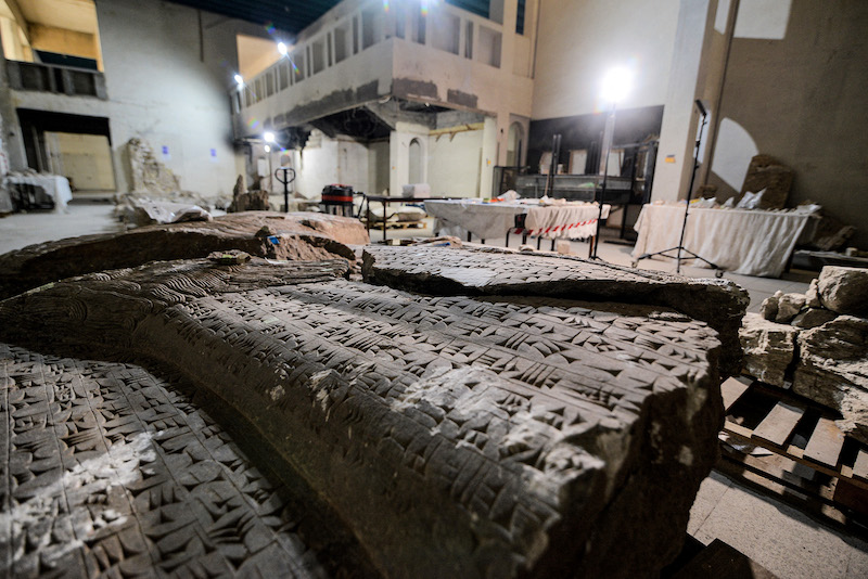 This picture taken on December 14, 2021 shows a view of a larger fragment of a statue of the ancient Mesopotamian u00e2u20acu02dclamassuu00e2u20acu2122 human-headed winged bull being reassembled at the Mosul Museum in Iraq's northern city. u00e2u20acu201d AFP pic