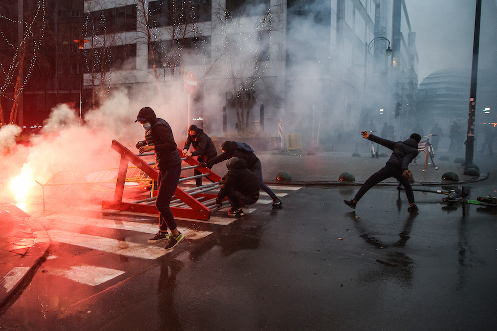 Protestors throw urban property during a demonstration against Covid-19 vaccination in Brussels December 19, 2021. u00e2u20acu201d AFP pic
