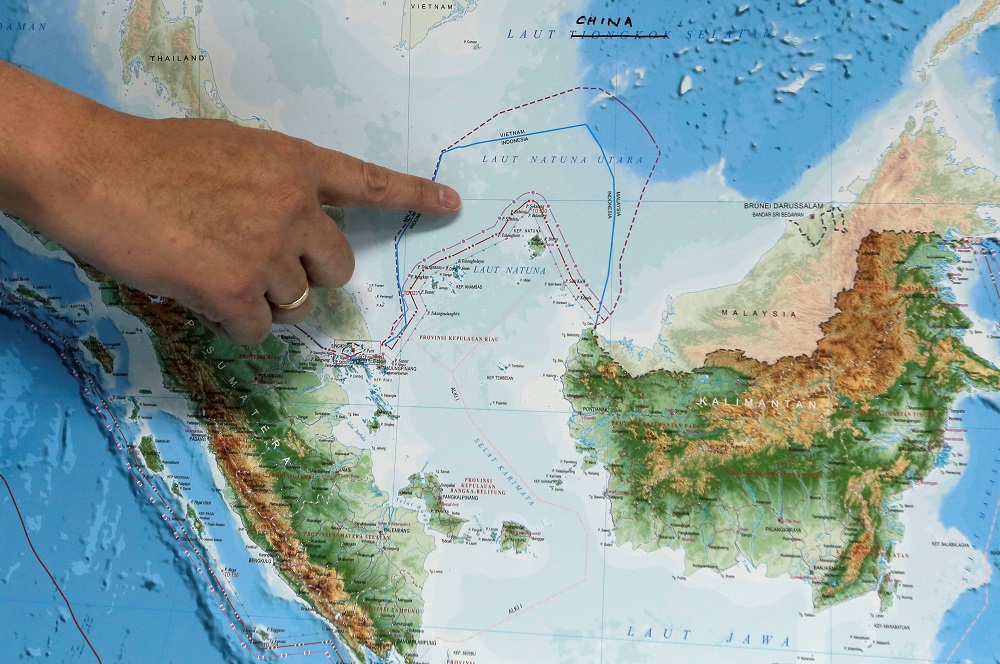 Indonesiau00e2u20acu2122s Deputy Minister for Maritime Affairs Arif Havas Oegroseno points at the location of North Natuna Sea on a new map of Indonesia during talks with reporters in Jakarta July 14, 2017. u00e2u20acu201d Reuters pic
