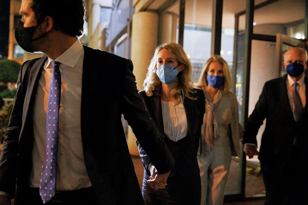 After attending the second day of final arguments in her fraud trial, Theranos founder Elizabeth Holmes (second left) departs the federal court in San Jose December 17, 2021. u00e2u20acu201d Reuters pic