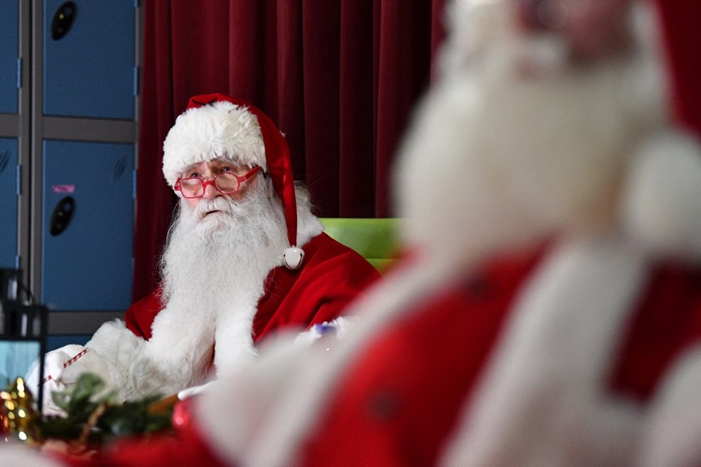 Santas sit in class as they take part in Santa School at The Ministry of Fun in London November 30, 2021, a series of training courses for professional UK Santas. u00e2u20acu201d AFP pic