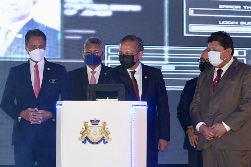 Johor Mentri Besar Datuk Hasni Mohammad (3rd left) during the JohorPay application and Johor Project Monitoring System (JoMS) at the Thistle Hotel in Johor Baru December 2, 2021. u00e2u20acu201d Picture by Ben Tan