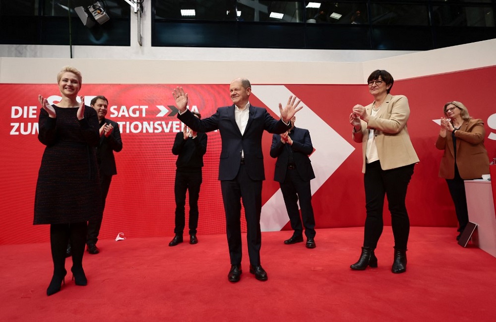 Germanyu00e2u20acu2122s Social Democrats Party (SPD) candidate for chancellor Olaf Scholz is applauded during a hybrid party conference for the approval of the so-called traffic light coalition agreement at the party headquarters in Berlin December 4, 2021. u00e2u20acu201d AFP p