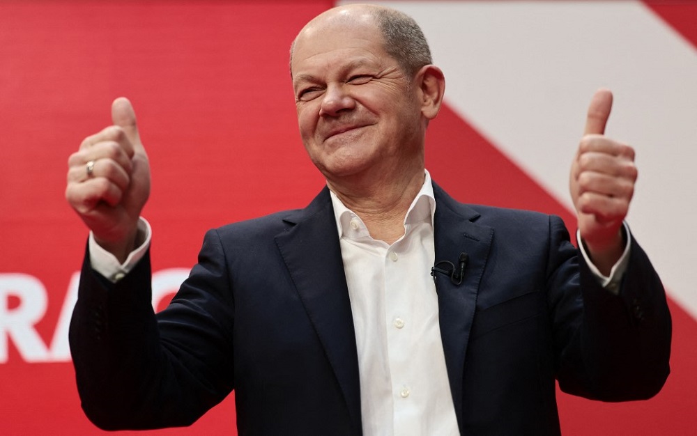 Germanyu00e2u20acu2122s Social Democrats Party (SPD) candidate for chancellor Olaf Scholz gestures during a hybrid party conference for the approval of the so-called traffic light coalition agreement at the party headquarters in Berlin December 4, 2021.nu00e2u20acu201d AFP picn