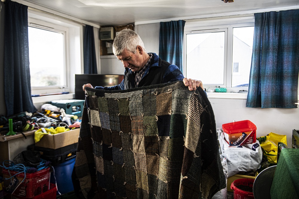 Harris tweed weaver Ian Mackay works on his pedal powered loom in his weaving shed in Shawbost on the Isle Of Lewis. u00e2u20acu201d AFP pic