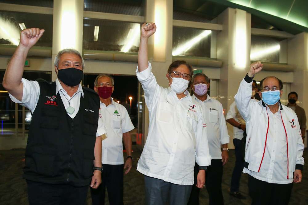 Gabungan Parti Sarawaku00e2u20acu2122s (GPS) Gedung candidate Tan Sri Abang Johari Openg (centre) arrives at Borneo Convention Centre for the party manifesto launch in Kuching December 8, 2021. u00e2u20acu201d Picture by Yusof Mat Isa 