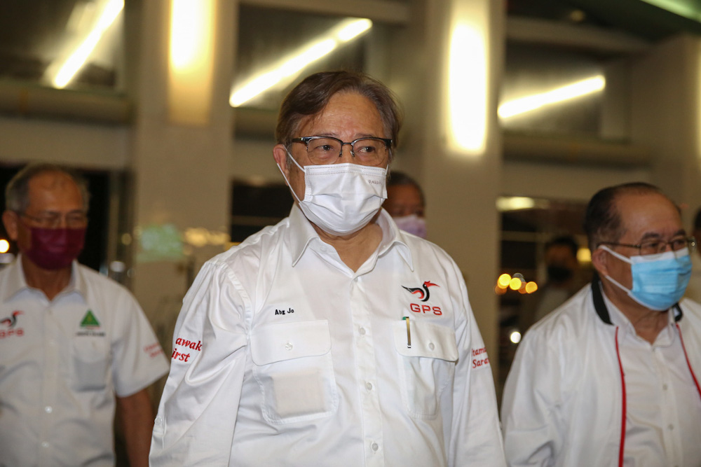 Gabungan Parti Sarawaku00e2u20acu2122s (GPS) Gedung candidate Tan Sri Abang Johari Openg (centre) arrives at Borneo Convention Centre for the party manifesto launch in Kuching December 8, 2021. u00e2u20acu201d Picture by Yusof Mat Isa 