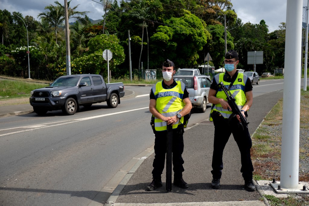 Gendarmes secure the road of Saint Michel, on the day of the vote for the referendum on independence, in Mont Dore, on the French South Pacific territory of New Caledonia on December 12, 2021. u00e2u20acu201d AFP pic 