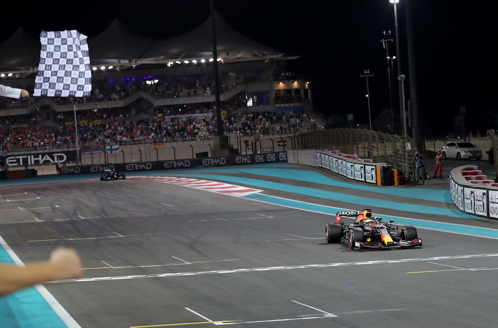 Red Bull's Max Verstappen crosses the line to win the race and the world championship at the Abu Dhabi Grand Prix at Yas Marina Circuit, Abu Dhabi, United Arab Emirates December 12, 2021  u00e2u20acu201d Pool via Reuters picnn