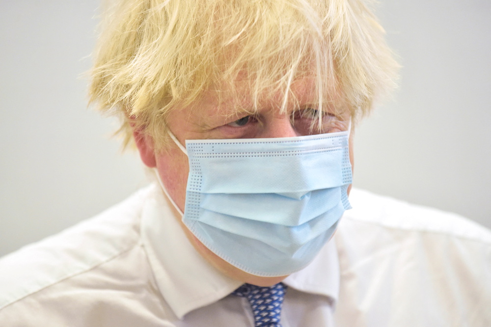 British Prime Minister Boris Johnson visits Stow Health vaccination centre in Westminster, London, Britain December 13, 2021. u00e2u20acu201d Reuters pool pic