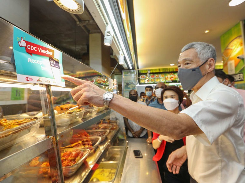 Prime Minister Lee Hsien Loong (pictured) said that the Community Development Council vouchers are meant to support shops and hawker stalls in neighbourhoods that have been hit hard by the Covid-19 pandemic. u00e2u20acu201d Picture by Ministry of Communications and I