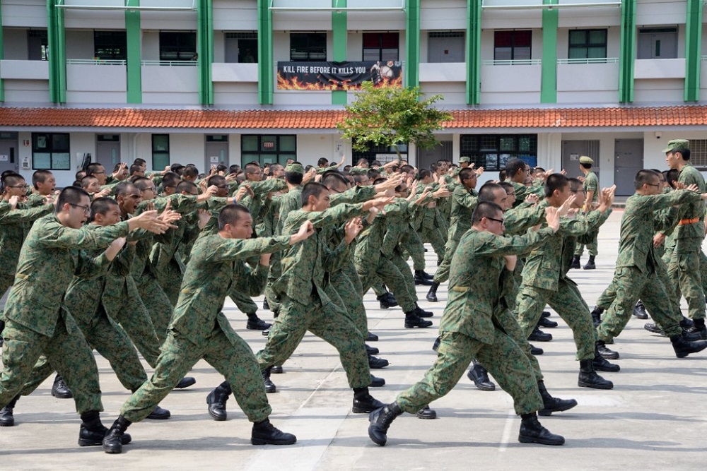 In this file photo taken on February 7, 2017 National Service recruits demonstrate hand-to-hand combat moves as part of their two-month basic training on Pulau Tekong off Singapore. u00e2u20acu201d AFP pic