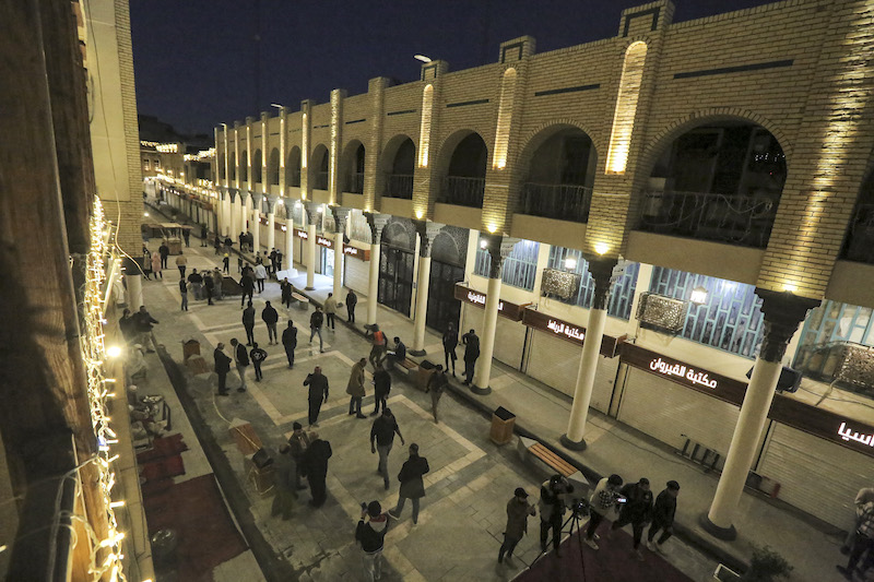 This picture taken on December 25, 2021 shows a view of the reopening of the renovated al-Mutanabbi street, the historic heart of the book trade and an outlet for writers and intellectuals, in the centre of Iraq's capital Baghdad. u00e2u20acu201d AFP pic