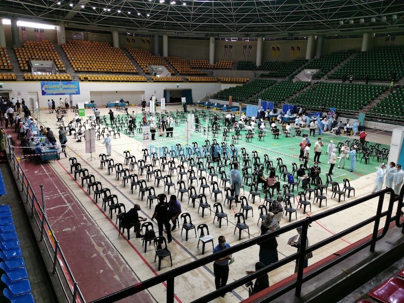 File photo shows healthcare personnel and volunteers getting the PPV at Stadium Perpaduan in Kuching ready for the first phase of the NCIP in Sarawak, which ran from Feb 26 until March 31, 2021. — Borneo Post pic
