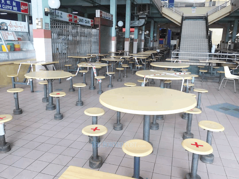 This photo, taken prior to SDMC’s announcement of dining-in being allowed at eateries in mid-July, shows the empty food court at Sibu Central Market. — Picture by Peter Boon via Borneo Post