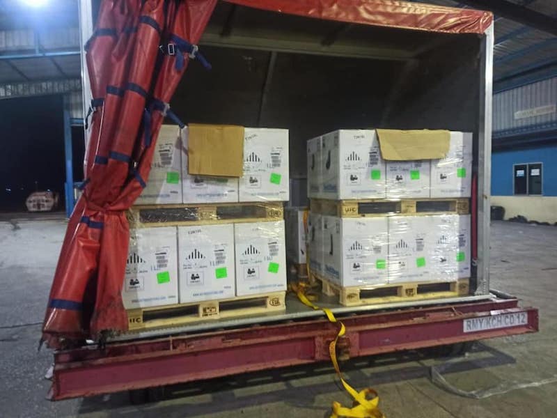 A batch of Pfizer-BioNTech Covid-19 vaccines arriving at Kuching International Airport from Belgium on October 11, 2021. — Picture courtesy of Facebook/ Dr Sim Kui Hian