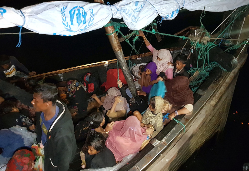 Rohingya refugees arrive by boat at a port in Lhokseumawe, Aceh, Indonesia December 31, 2021. u00e2u20acu201d Reuters pic