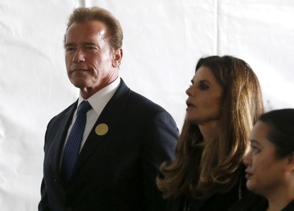 Arnold Schwarzenegger (left) and Maria Shriver walk to the grave site at the funeral of Nancy Reagan at the Ronald Reagan Presidential Library in Simi Valley, California March 11, 2016. u00e2u20acu201d Reuters picnn