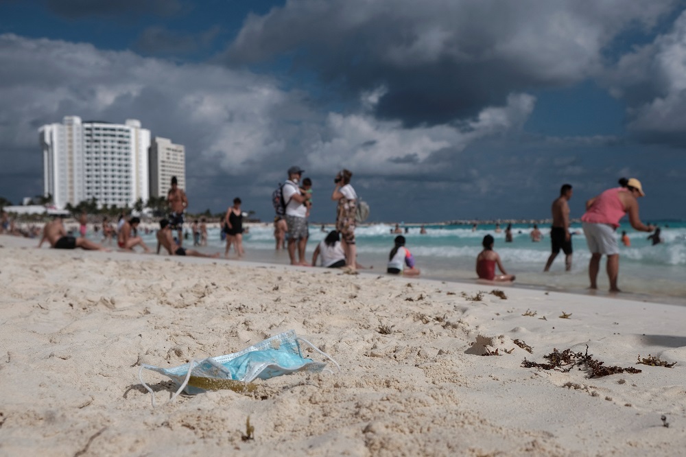 People are seen at the beach as the Covid-19 pandemic continues, in Cancun, Mexico December 27, 2021. u00e2u20acu2022 Reuters pic
