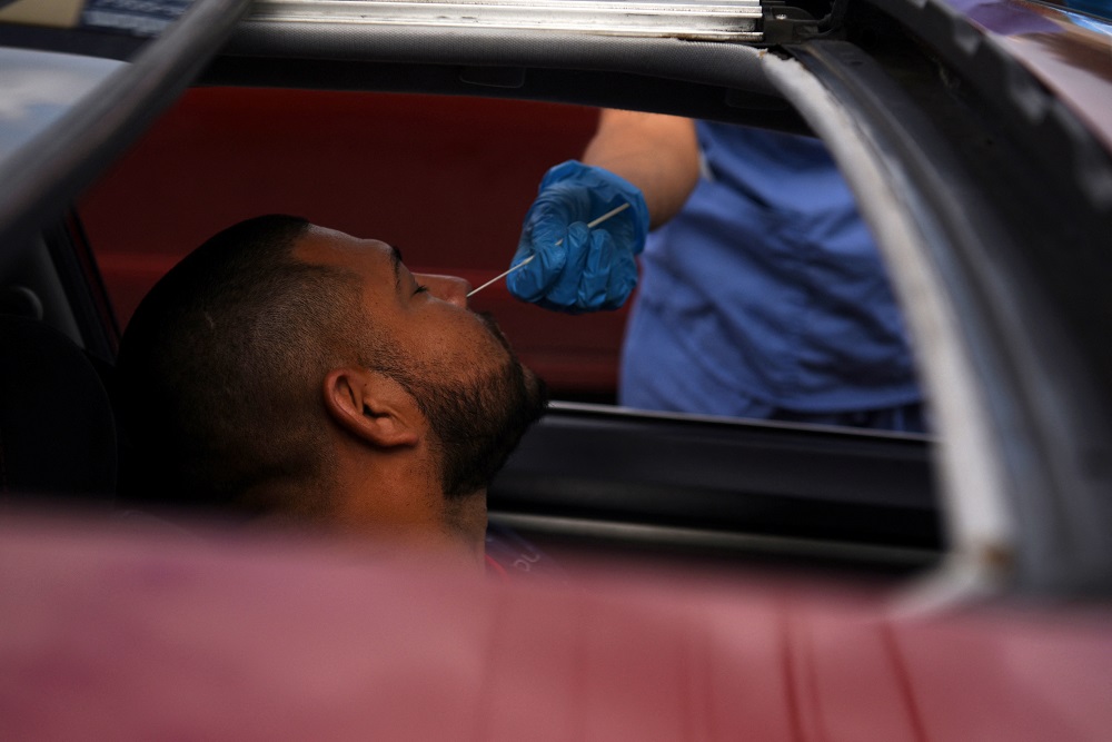A man is tested for the coronavirus at a drive-through testing site as the Omicron variant continues to spread through the country in Houston, Texas December 29, 2021. u00e2u20acu2022 Reuters pic