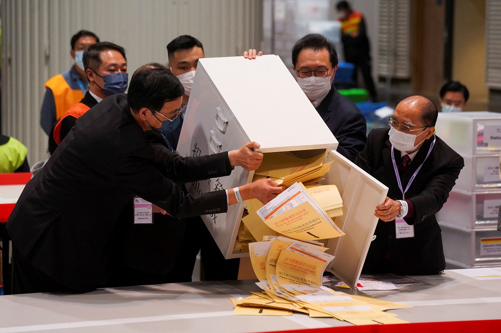 The chairman of Electoral Affairs Commission Barnabas Fung Wah and other members of EAC open the ballot box for the Legislative Council election at a vote counting centre, in Hong Kong December 19, 2021. u00e2u20acu2022 Reuters pic