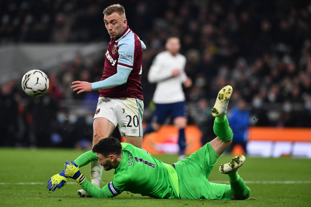 Tottenham Hotspur goalkeeper Hugo Lloris saves at the feet of West Ham United striker Jarrod Bowen during the English League Cup quarterfinal match at Tottenham Hotspur Stadium in London, December 22, 2021. u00e2u20acu201d AFP pic 