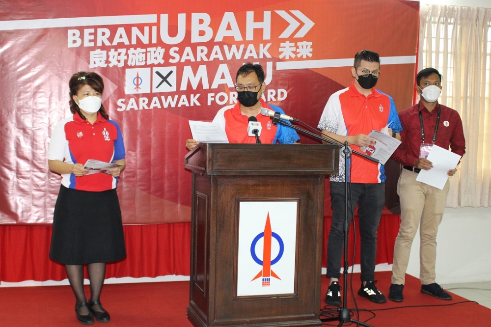 Chong speaks at the press conference in DAP Sarawak headquarters in Kuching. He is accompanied by Yong (from left), Dr Yii and Abdul Aziz. u00e2u20acu201d Borneo Post Online pic