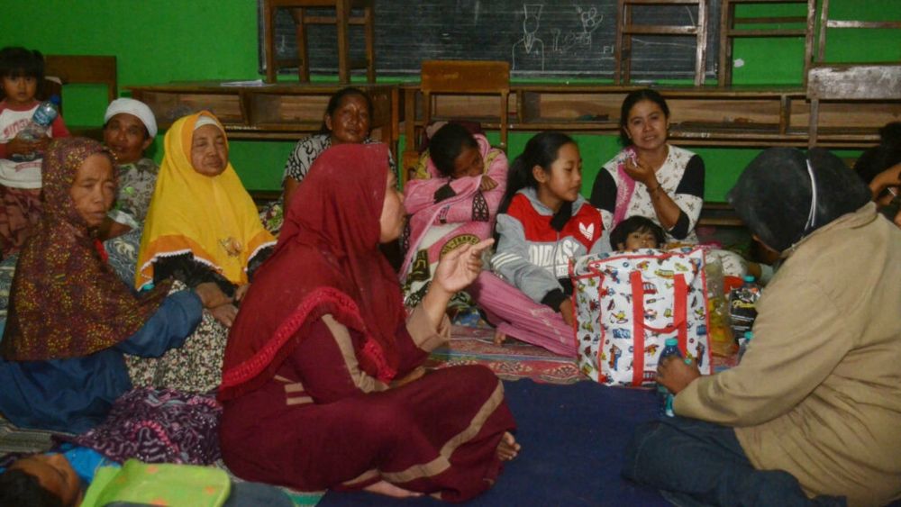 Evacuees take shelter in a classroom in the Indonesian village of Sumberurip on December 4, 2021, after the Semeru volcano erupted. u00e2u20acu201d AFP pic