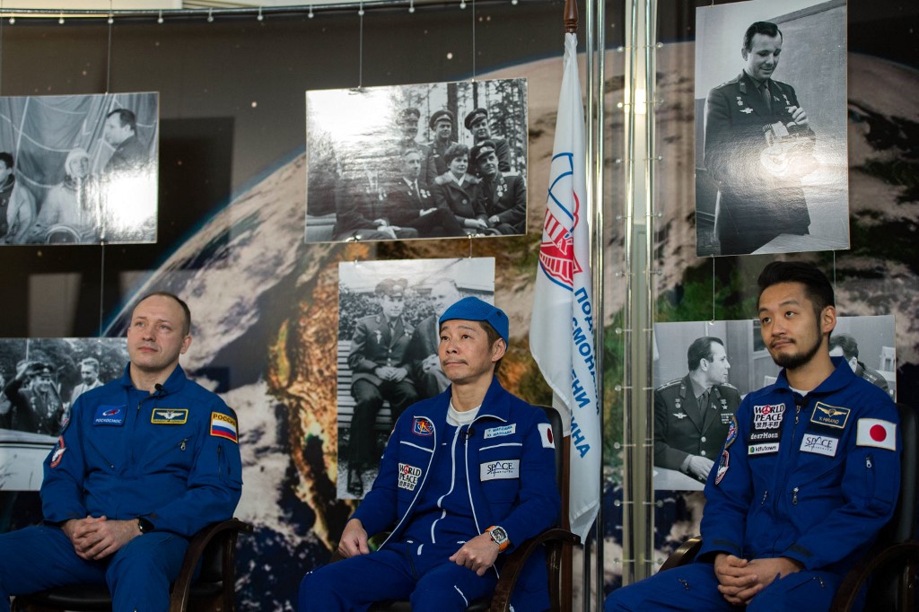 (From left) Russian cosmonaut Alexander Misurkin and space flight participants Japanese billionaire Yusaku Maezawa and production assistant Yozo Hirano attend a post-flight press conference in Star City on December 22, 2021. u00e2u20acu201d Russian space agency Rosco