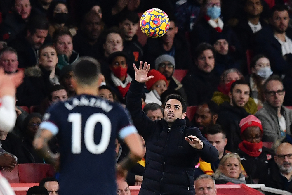 Arsenal manager Mikel Arteta catches the ball during the English Premier League football match between Arsenal and West Ham United at the Emirates Stadium in London, December 15, 2021. u00e2u20acu201d AFP pic 