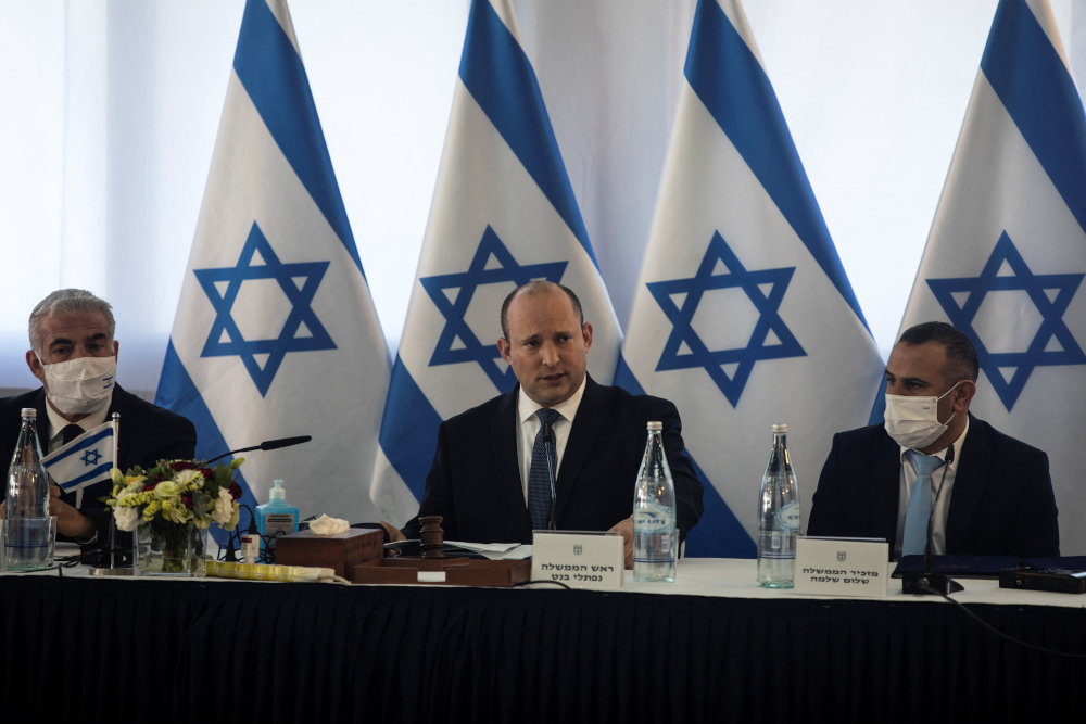 Israeli Prime Minister Naftali Bennett speaks at the weekly cabinet meeting in Kibbutz Mevo Hama in the Israeli-occupied Golan Heights, December 26, 2021. u00e2u20acu201d Reuters picnn