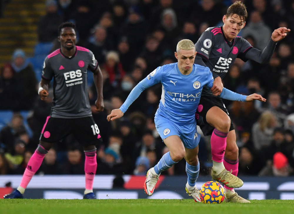 Leicester City defender Jannik Vestergaard challenges Manchester City midfielder Phil Foden during the English Premier League match at the Etihad Stadium in Manchester, north-west England, December 26, 2021. u00e2u20acu201d AFP pic 