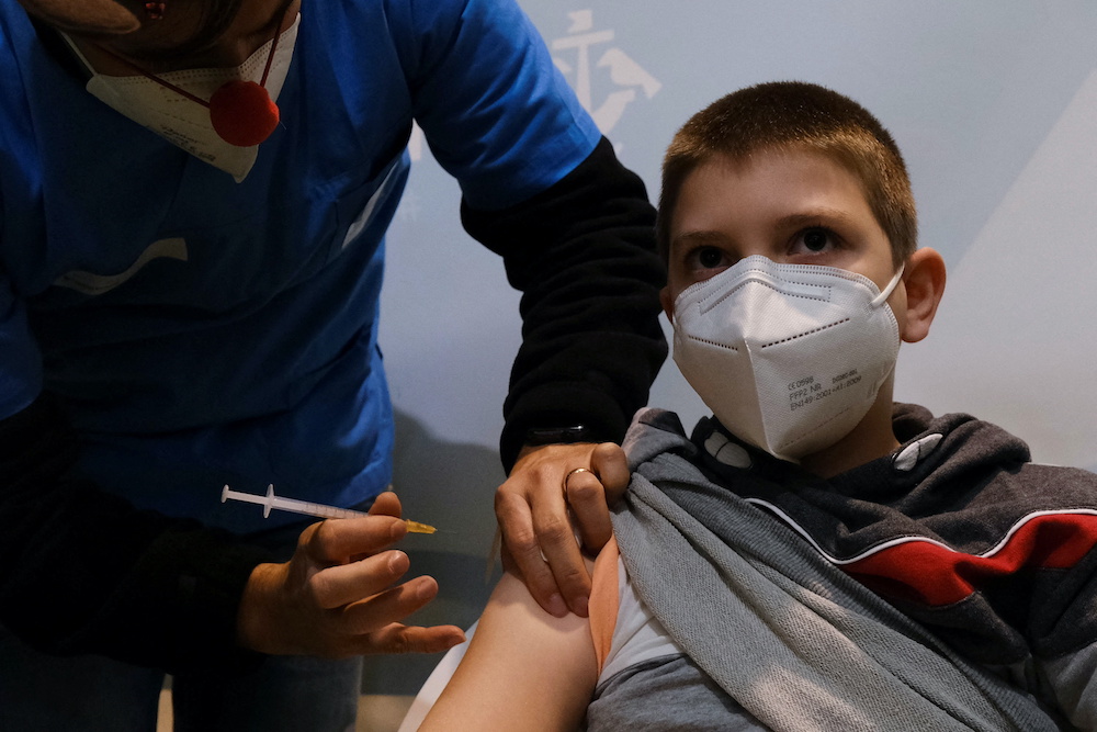 Afonso, 11, receives his first dose of coronavirus disease vaccine at the Ajuda vaccination centre as Portugal begins vaccinating 5 to 11 year-olds, in Lisbon, Portugal, December 18, 2021. u00e2u20acu201d Reuters picnnn