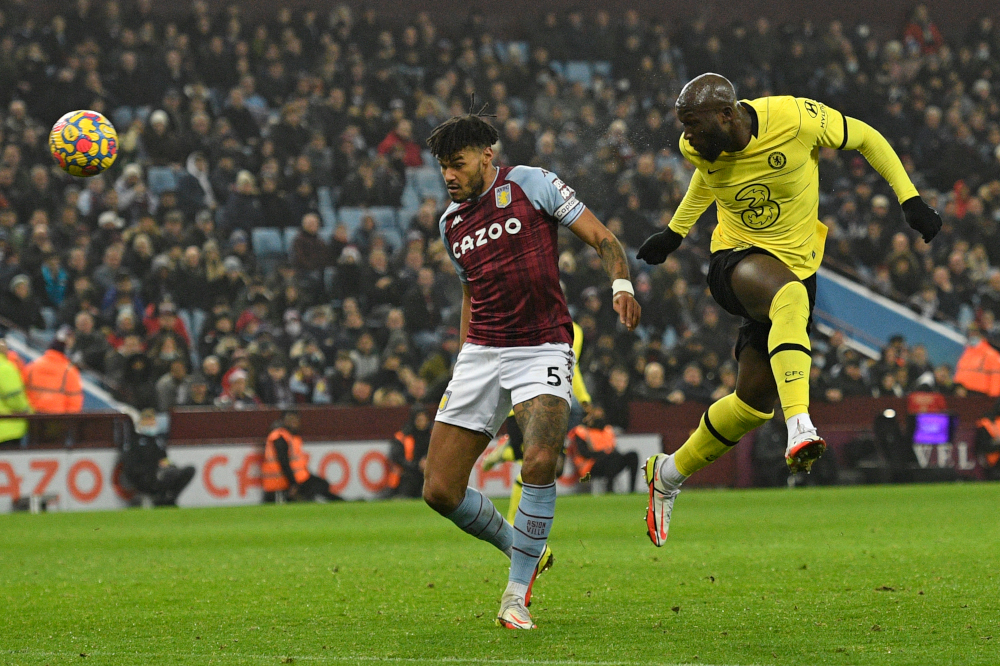 Chelsea striker Romelu Lukaku heads past Aston Villa defender Tyrone Mings for Chelseau00e2u20acu2122s second goal at Villa Park in Birmingham, central England, December 26, 2021. u00e2u20acu201d AFP picnn