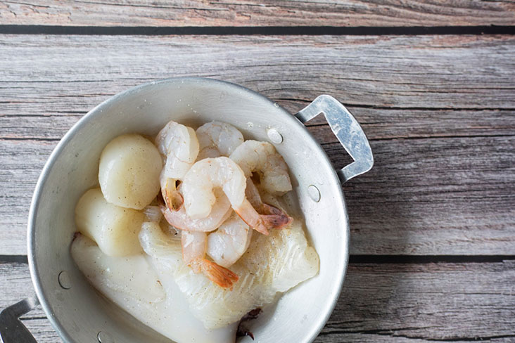 Besides fish, the assortment of seafood may include squid, scallops and shrimp.
