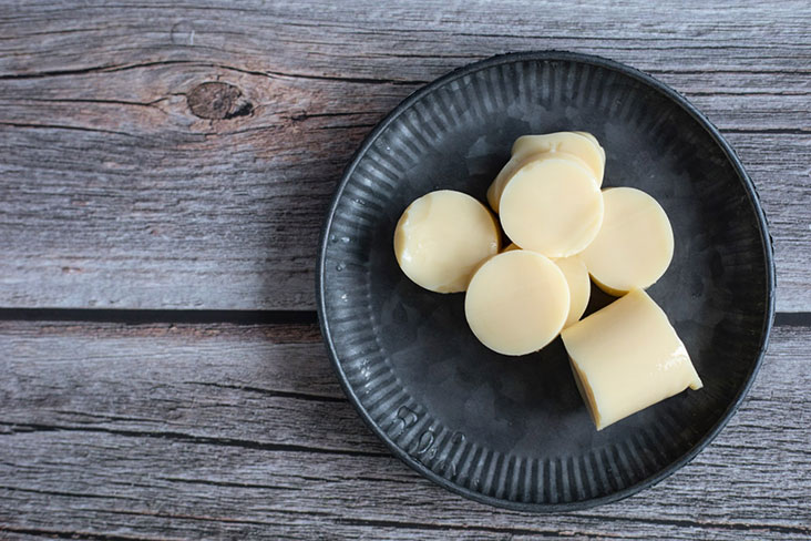Slice a tube of Japanese tofu into thick coins like these.