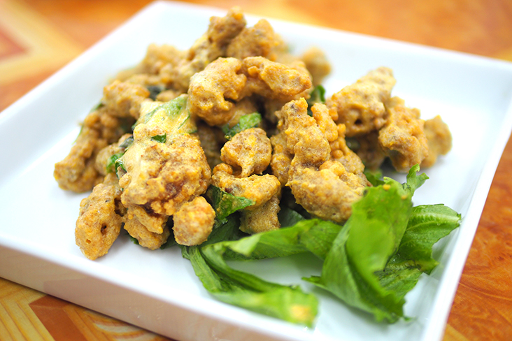The mantis prawns are coated in batter and deep fried for a crunchy bite that is paired with creamy salted egg yolk.