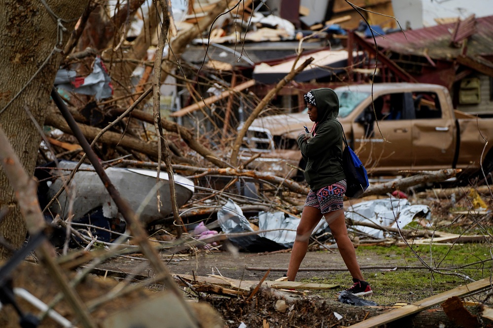 Vinisha Stubblegield, 38, walks amongst the rubble and debris in her neighbourhood after a devastating outbreak of tornadoes ripped through several US states in Mayfield, Kentucky, US December 15, 2021. u00e2u20acu2022 Reuters pic