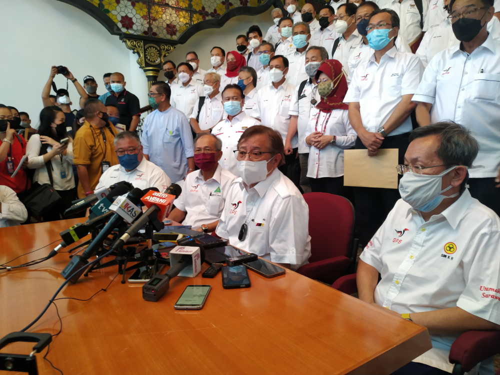 GPS chairman Tan Sri Abang Johari Openg (seated, centre) speaks at a news conference in Kuching, Sarawak December 3, 2021. u00e2u20acu201d Picture by Sulok Tawie