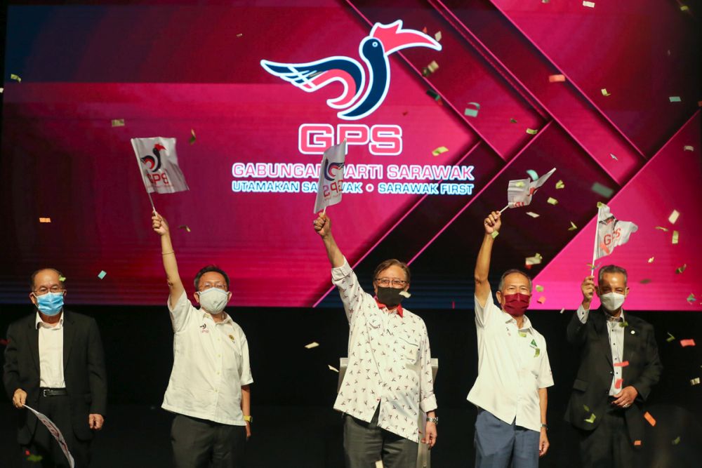 Tan Sri Abang Johari Openg (centre) and other GPS leaders celebrate after winning the Sarawak state election at the Borneo Convention Centre, Kuching December 18, 2021. u00e2u20acu2022 Picture by Yusof Mat Isa