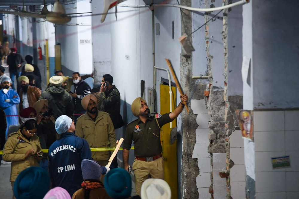 Police inspect the site of a blast, which reportedly killed at least two people and injured four, inside the court complex in Ludhiana, Punjab, on December 23, 2021. u00e2u20acu201d AFP pic