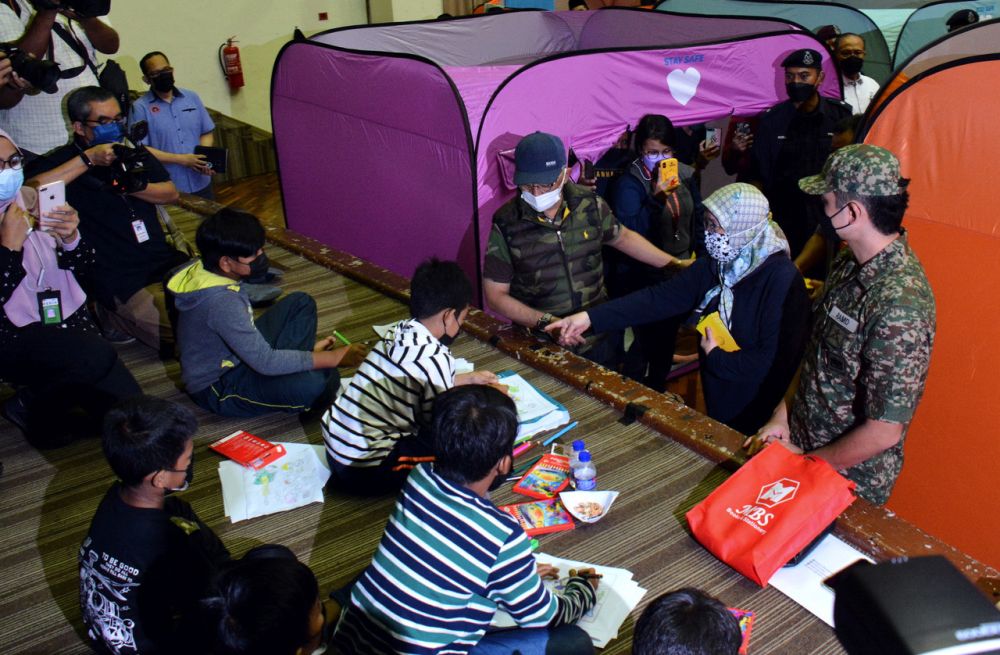 The Yang di-Pertuan Agong and Raja Permaisuri Agong are pictured during a visit to Wisma Belia PPS in Kuantan December 20, 2021.  u00e2u20acu201d Bernama pic