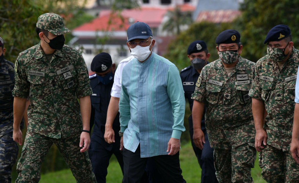 The King visits flood victims housed in temporary evacuation centres at in Raub district, Pahang December 21, 2021. u00e2u20acu201d Bernama pic 