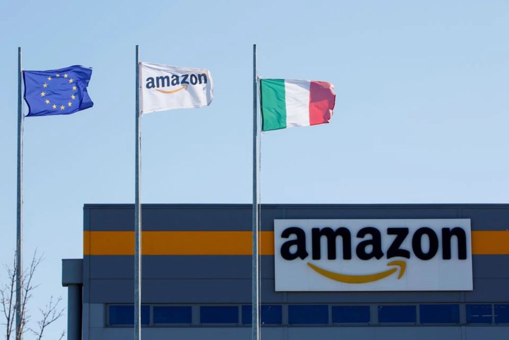 Flags flutter outside a distribution centre, during a strike at Amazonu00e2u20acu2122s logistics operations in Italy, in Passo Corese, Italy March 22, 2021. u00e2u20acu201d Reuters pic