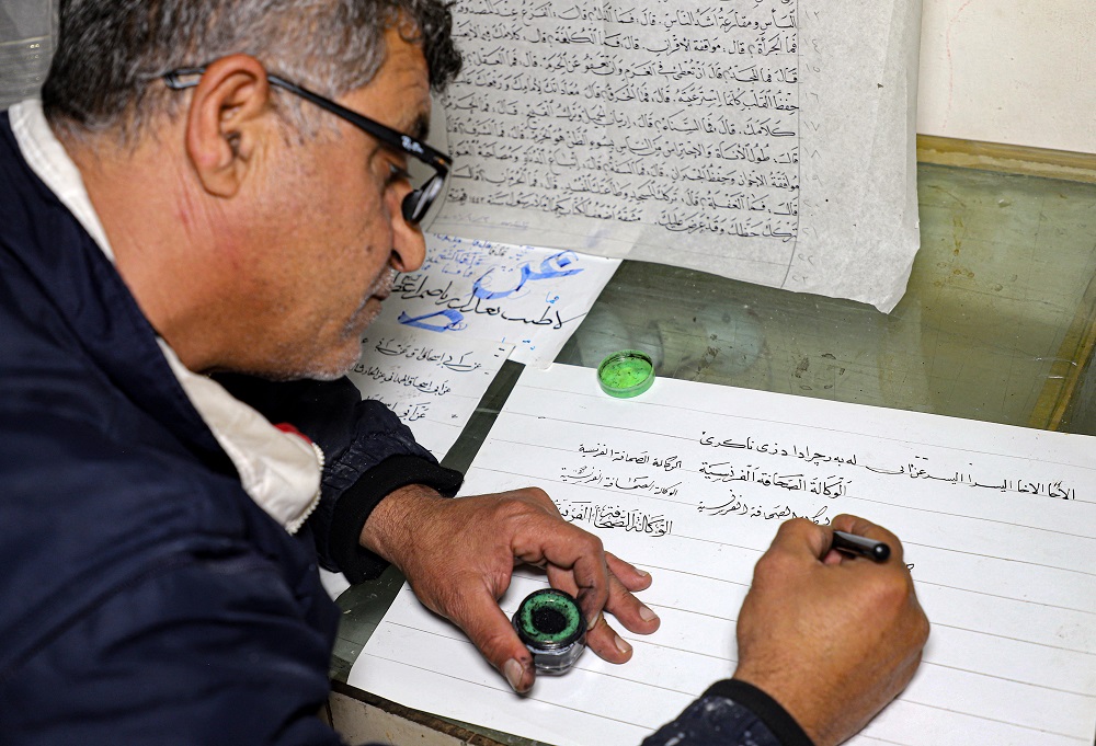 Jamal Hussein devotes his time to preserving the gentle art of Arabic calligraphy. u00e2u20acu2022 AFP pic